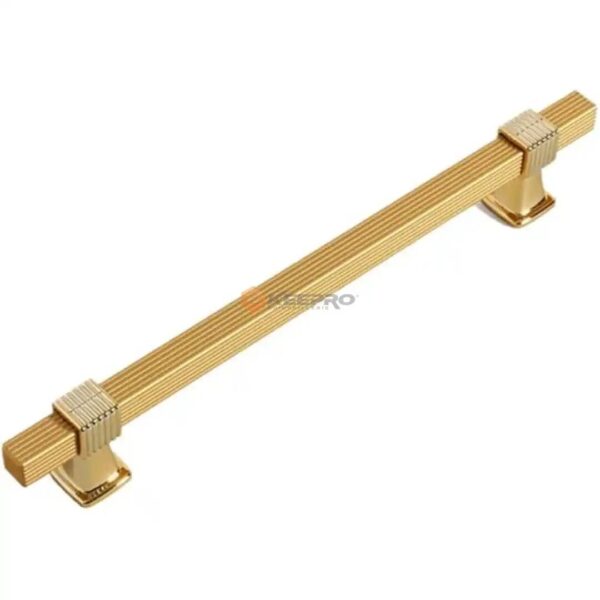 POIGNE MEUBLE COSTALE CARRE A RAYURE DORE  96-150MM